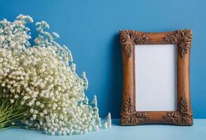 A wooden frame with white flowers on a blue background photo