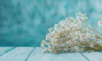 A bouquet of white flowers on a blue background photo