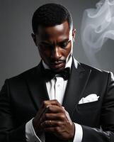 Elegant Man in Tuxedo with Smoke Background and Reflective Pose photo