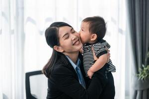 Joyful reunion in a modern office setting between mother and child during the workday photo