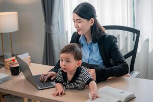Working mother balances tasks with a child in a cozy home office environment during the day photo