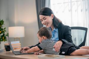 Working from home with toddler Balancing professional and parental duties in a modern workspace photo