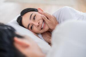 Close and affectionate moments shared between two people in a cozy setting during the daytime photo