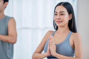 Group practicing yoga in a bright studio during a wellness class on a serene day photo