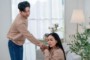 Emotional conversation between a couple in a bright room during the afternoon photo