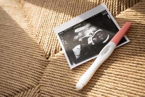 Ultrasound results in the second trimester of pregnancy. Photo of the fetus on a light geometric background. Expectation of the child. Infertility treatment. Artificial insemination. Having a baby