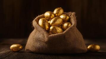 A burlap sack filled with golden chocolate eggs. 2 photo