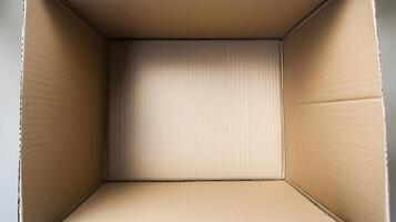 An open cardboard box with vertical deep walls viewed from the top. 16 photo