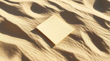 A blank square card on the sand, with shadows and ripples of sunlight. 5 photo