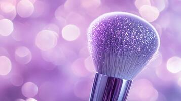 A makeup brush with glitter on the bristles, set against a purple bokeh background. 14 photo