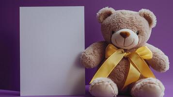 A teddy bear with yellow gold ribbon on purple background. 3 photo