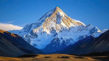 Snowy Mountain Peak Under Blue Sky in New Zealand Majestic Landscape featuring Jagged Rock and Ice Formations with Golden Sunlight Warm Hues photo