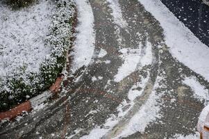 The entrace and exit way of the garage were covered with snow.frost and ice season. photo