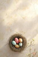 vertical composition top view small bird's nest with colorful eggs, placed on a light beige background with delicate floral patterns photo
