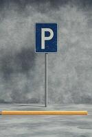 vertical image single parking sign with a blue and white design, placed on a clean gray pavement, surrounded by subtle yellow line photo
