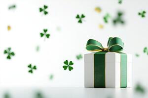 st Patrick composition small gift box wrapped in a green and gold ribbon, surrounded by floating trefoils leaves on light white background photo