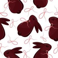 seamless pattern with chocolate Easter bunnies with pink ribbons arranged randomly, for Easter decorations vector