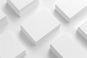 A collection of white business cards is displayed on a clean white surface, showcasing a minimalist design ideal for branding and professional networking photo