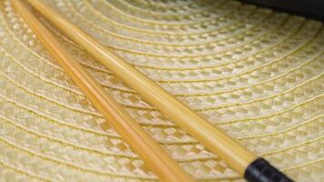 Delicious sushi rolls with chopsticks and soy sauce on woven mat displayed in varied arrangements video