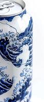 A close view showcases a striking white beer can adorned with intricate blue wave designs, evoking a sense of calm and excitement. This can stands out with artistic flair photo