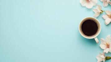 A warm cup of aromatic coffee rests on a light blue surface adorned with delicate flowers, creating a serene morning atmosphere. photo