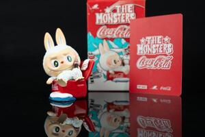 Samut Prakan, Thailand - February 20, 2025 Cute mystery box of Pop Mart cute character of Labubu the monsters x Coca Cola series photo