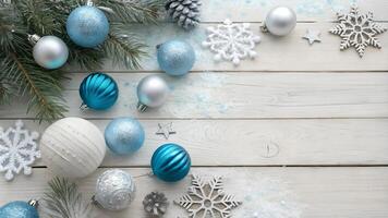 Festive Winter Scene with Ornaments and Snowflakes on Wooden Background photo