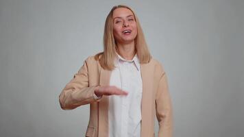 Woman showing inviting gesture with hands, ask to join, beckoning to coming, gesturing hello goodbye video