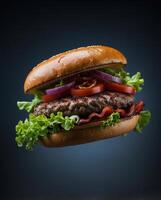 Delicious burger with fresh toppings isolated on dark background photo