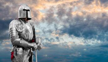 Knight in shiny metal armor. Reliable security. Copy space. photo