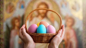 Hands lifting an Easter basket towards a divine icon in a church, illuminated by warm light. A symbol of faith and devotion. For Easter greeting cards, religious publications, spiritual-themed posters photo