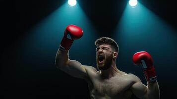 A determined boxer celebrates victory in the ring, illuminated by dramatic lighting. His red gloves emphasize the intense athletic moment. photo