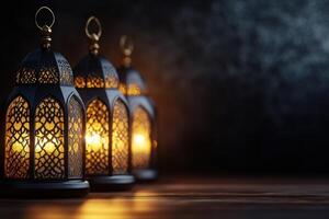 Three ornate lanterns glow in the dark, creating a warm and inviting atmosphere on the wooden floor photo