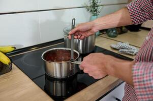 Man Preparing Sauce on a Stovetop photo
