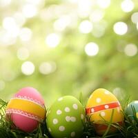 Easter colored eggs in grass. Easter abstract background with blurred background and copy space. photo