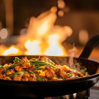 Pan fried chicken with vegetables. Stir-fried chicken with green beans in a frying pan on open fire. photo