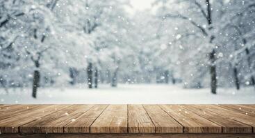 Wooden table in winter forest with snow falling photo