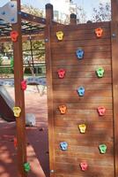 Colorful climbing wall in a children's playground during daytime photo