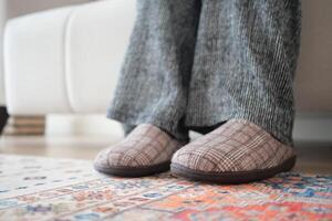 Cozy afternoon at home with comfortable slippers on a patterned rug photo