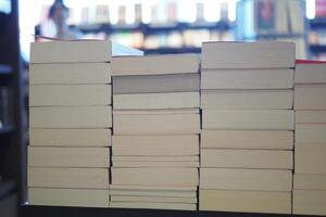 Stack of unmarked books in a cozy reading space photo