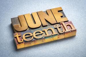 Juneteenth, June 19, also known as Freedom, Jubilee, Liberation, and Emancipation Day, a holiday celebrating the emancipation of those who had been enslaved in the US, wood type text photo