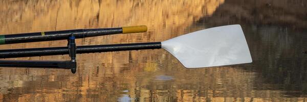 oars of a sculling shell in sandstone canyon of Horsetooth Reservoir in Colorado in fall scenery photo