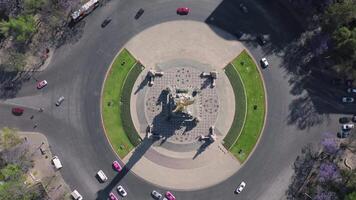 an aerial view of a circular park with a statue video