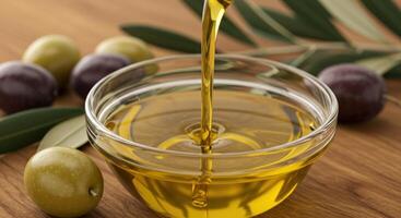 Clear Bowl Catches Flowing Olive Oil and Olives. photo