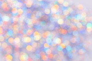 Defocused abstract bokeh background pastel colored, flare from lights, color gradient, blurred circle bokeh as holiday texture. Glittering aesthetic textured lighting pattern photo