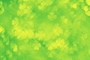 Floral figured Bokeh in yellow green Hues, Abstract bokeh background, natural flare from lights, blurred clover leaves shapes texture as holiday backdrop, celebration idea with optical effect photo