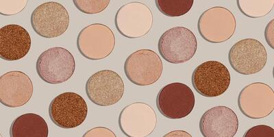 Pattern with refill eye shadow beige brown natural color on neutral colored background, banner. Makeup palette eyeshadows powder, shine and matte, minimal aesthetic photo pastel color, top view