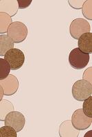 Creative frame with eye shadow swatches, beige brown skin tone colors on beige background, copy space. Eyeshadows powder for makeup, cosmetic design minimal style, top view beauty backdrop photo