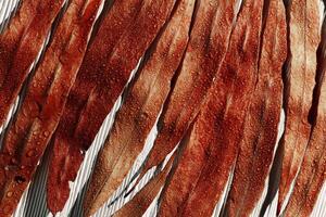 Natural autumn pattern from red wet leaves with raindrops on white wood background, top view fall leaf, abstract nature texture macro background, botanical nature view, autumn colors still life photo