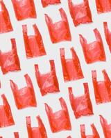 Top view pattern from Red plastic bags. Single-use polythene packet, Eco trend to reduce disposable plastics, Biodegradable packaging waste, creative photo pattern as design background